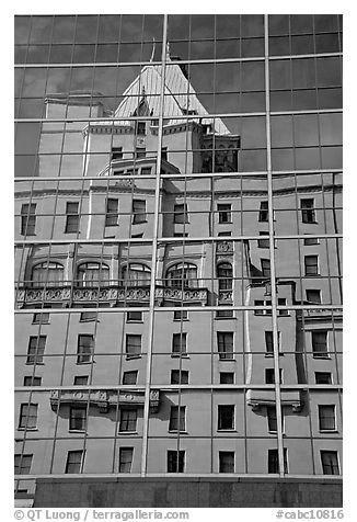 Buildings reflected in the glass windows of a high-rise buildings. Vancouver, British Columbia, Canada (black and white)