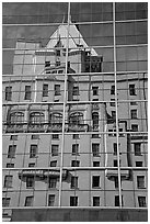 Buildings reflected in the glass windows of a high-rise buildings. Vancouver, British Columbia, Canada (black and white)