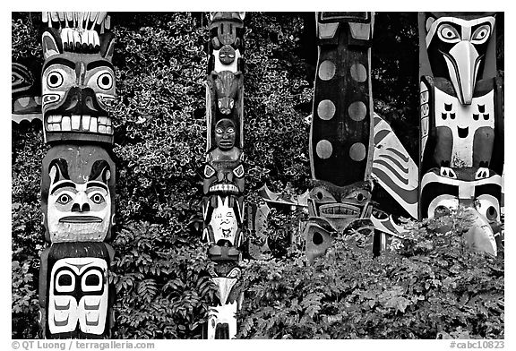 Totem collection, near the Capilano suspension bridge. Vancouver, British Columbia, Canada (black and white)