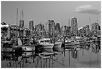 Small boat harbor and skyline at dusk. Vancouver, British Columbia, Canada (black and white)