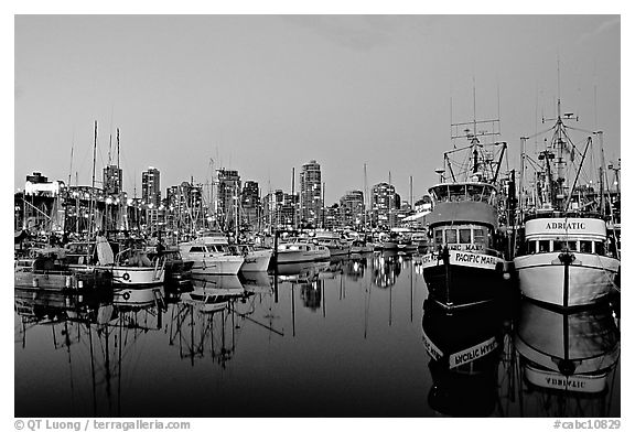 Fishing boats and skyline at dusk. Vancouver, British Columbia, Canada (black and white)