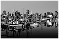 Fishing boats and skyline at night. Vancouver, British Columbia, Canada ( black and white)