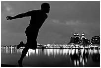 Harry Jerome (a former great sprinter)  statue and Harbor at night. Vancouver, British Columbia, Canada (black and white)