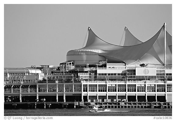 Seaplane taking off in front of Canada Palace. Vancouver, British Columbia, Canada