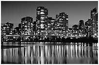 High-rise buildings reflected in False Creek at night. Vancouver, British Columbia, Canada ( black and white)