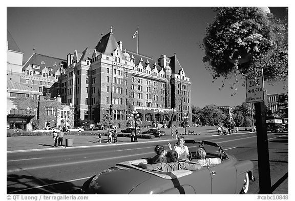 Red convertible car and Empress hotel. Victoria, British Columbia, Canada