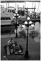 Street performers on the quay of Inner Harbor. Victoria, British Columbia, Canada (black and white)