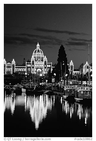 Parliament buildings lights reflected in the harbor. Victoria, British Columbia, Canada (black and white)
