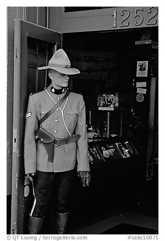Mannequin representing a Canadian police at the entrance of a store. Victoria, British Columbia, Canada (black and white)