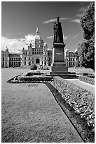 Lawn, statue of Queen Victoria for whom the city was named, and parliament. Victoria, British Columbia, Canada (black and white)