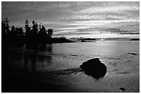 Rock and bay at sunset, Half-moon bay. Pacific Rim National Park, Vancouver Island, British Columbia, Canada (black and white)