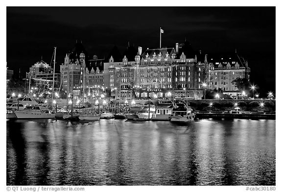 Empress hotel reflected in the Inner Harbour a night. Victoria, British Columbia, Canada (black and white)