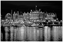 Empress hotel reflected in the Inner Harbour a night. Victoria, British Columbia, Canada (black and white)