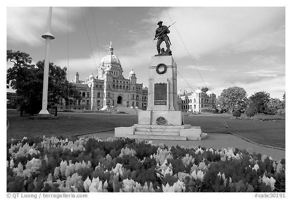 Flowers, memorial, and parliament building. Victoria, British Columbia, Canada (black and white)