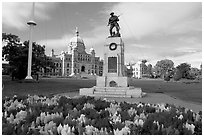 Flowers, memorial, and parliament building. Victoria, British Columbia, Canada (black and white)