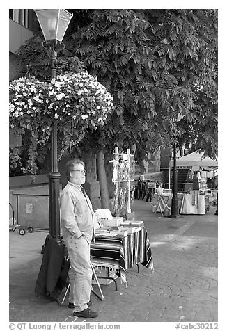 Street art exhibitor, Bastion Square. Victoria, British Columbia, Canada (black and white)
