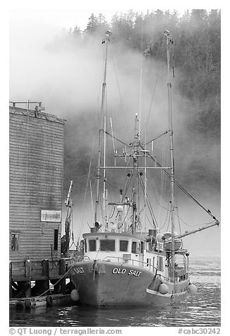Commercial fishing boat and fog, Tofino. Vancouver Island, British Columbia, Canada (black and white)