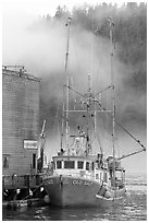 Commercial fishing boat and fog, Tofino. Vancouver Island, British Columbia, Canada ( black and white)