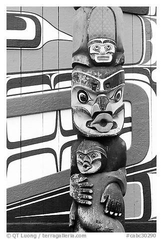 Totem pole and wall of Carving studio. Victoria, British Columbia, Canada (black and white)