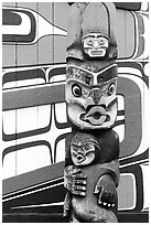 Totem pole and wall of Carving studio. Victoria, British Columbia, Canada (black and white)