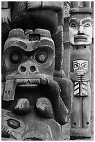 Totem poles in Thunderbird Park. Victoria, British Columbia, Canada ( black and white)
