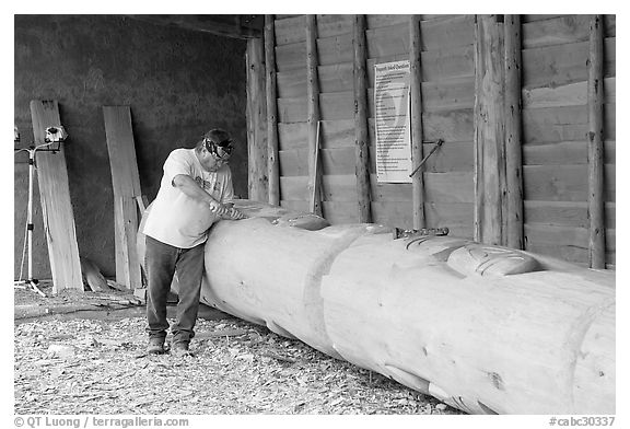 Artist carving a totem pole. Butchart Gardens, Victoria, British Columbia, Canada