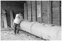 Artist carving a totem pole. Butchart Gardens, Victoria, British Columbia, Canada (black and white)