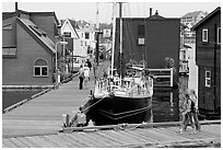 Houseboats, deck, and sailboat, Upper Harbour. Victoria, British Columbia, Canada (black and white)