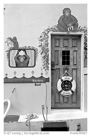 Door of houseboat decorated with a monkey theme. Victoria, British Columbia, Canada (black and white)