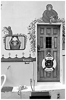 Door of houseboat decorated with a monkey theme. Victoria, British Columbia, Canada ( black and white)