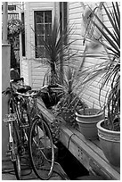 Bicycles, potted plants, and houseboat. Victoria, British Columbia, Canada (black and white)