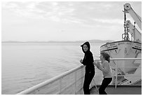 Woman and girl looking out from deck of ferry. Vancouver Island, British Columbia, Canada ( black and white)
