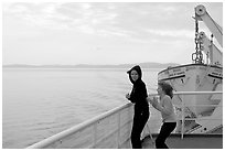 Woman and girl looking out from deck of ferry. Vancouver Island, British Columbia, Canada (black and white)