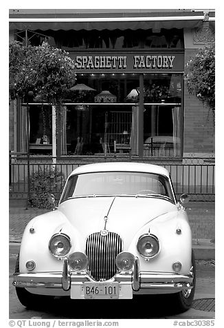 Classic car in front of Spaghetti Factory restaurant. Vancouver, British Columbia, Canada (black and white)