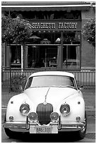 Classic car in front of Spaghetti Factory restaurant. Vancouver, British Columbia, Canada (black and white)