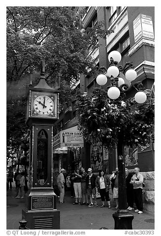Tourists watch steam clock in Water Street. Vancouver, British Columbia, Canada (black and white)