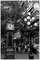 Tourists watch steam clock in Water Street. Vancouver, British Columbia, Canada (black and white)