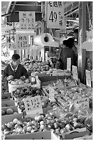 Fruit store in Chinatown. Some of the tropical fruit cannot be imported to the US. Vancouver, British Columbia, Canada (black and white)