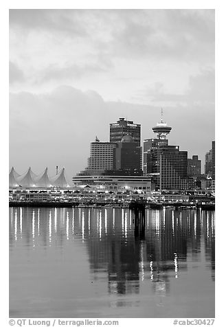 Canada Palace at night and Harbor Center at dawn. Vancouver, British Columbia, Canada