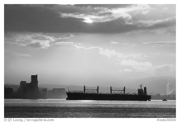 Cargo ship in harbor a sunrise. Vancouver, British Columbia, Canada (black and white)