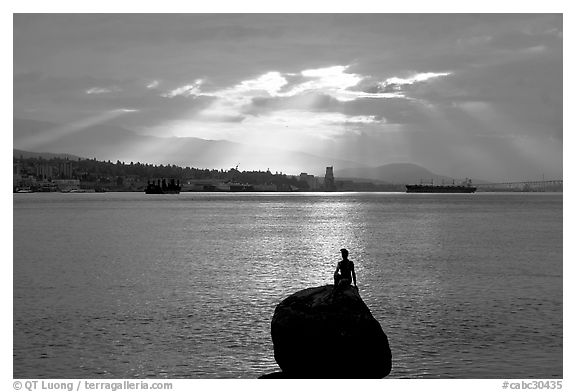 Girl in wetsuit statue, sunrise, Stanley Park. Vancouver, British Columbia, Canada (black and white)