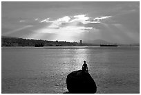 Girl in wetsuit statue, sunrise, Stanley Park. Vancouver, British Columbia, Canada (black and white)