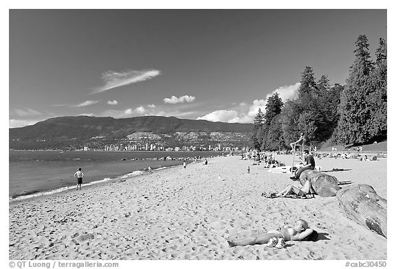 Woman sunning herself on a beach, Stanley Park. Vancouver, British Columbia, Canada
