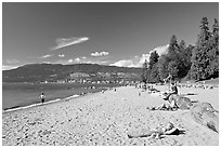 Woman sunning herself on a beach, Stanley Park. Vancouver, British Columbia, Canada (black and white)