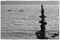 Balanced rocks and kayaks in a distance. Vancouver, British Columbia, Canada (black and white)