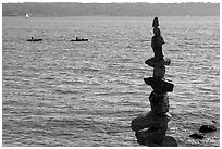 Balanced rocks and kayaks in a distance. Vancouver, British Columbia, Canada (black and white)
