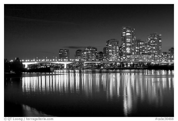 Skyline seen across False Creek at night. Vancouver, British Columbia, Canada