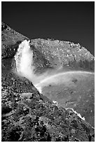 Rainbow formed in the mist of Takakkaw Falls. Yoho National Park, Canadian Rockies, British Columbia, Canada ( black and white)