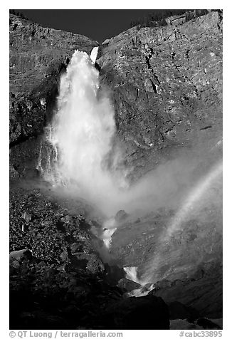 Takkakaw Falls, mist, and rainbow, late afternoon. Yoho National Park, Canadian Rockies, British Columbia, Canada (black and white)