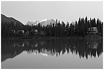 Trees and cabins reflected in Emerald Lake, dusk. Yoho National Park, Canadian Rockies, British Columbia, Canada (black and white)